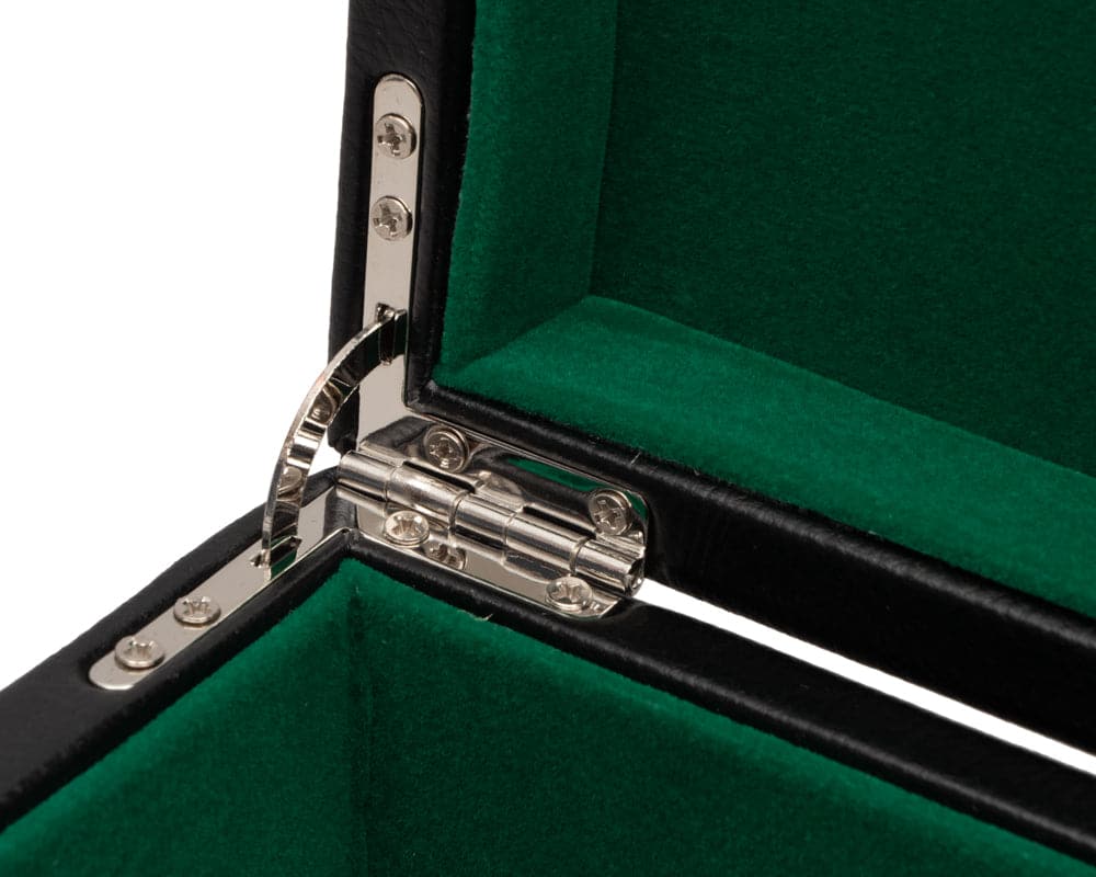 Close-up of chrome hinge and green cushioned interior of black leatherette chess piece case