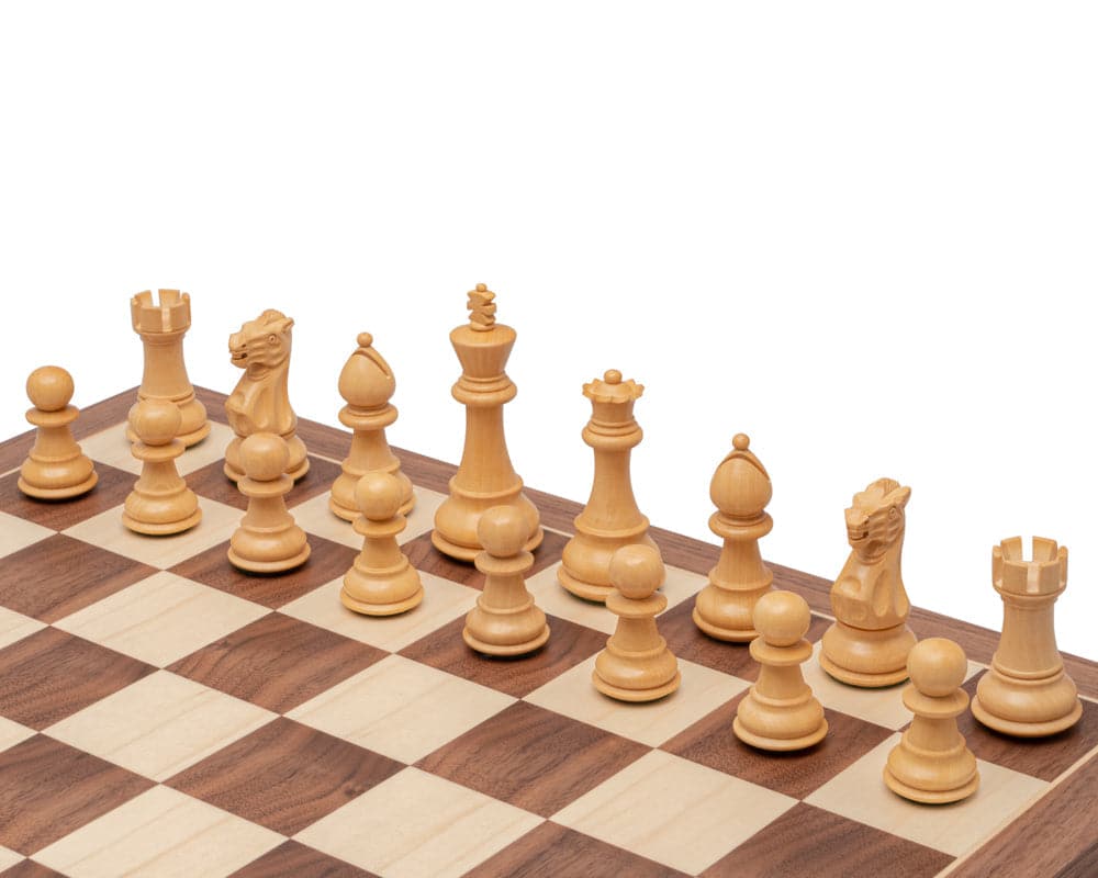 3.5 Inch Classic Staunton Chessmen in Acacia Wood on chess board, featuring a traditional design with a 3.5 inch king and two extra queens.