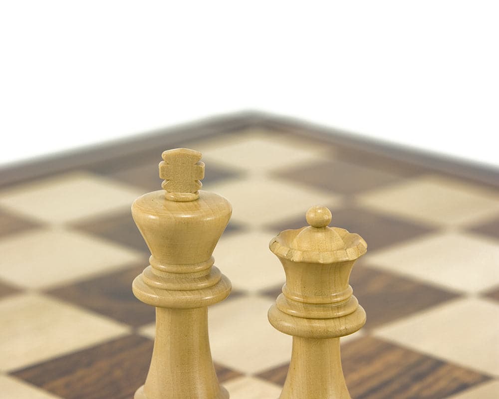 Down Head black chess king and queen pieces on European chess board