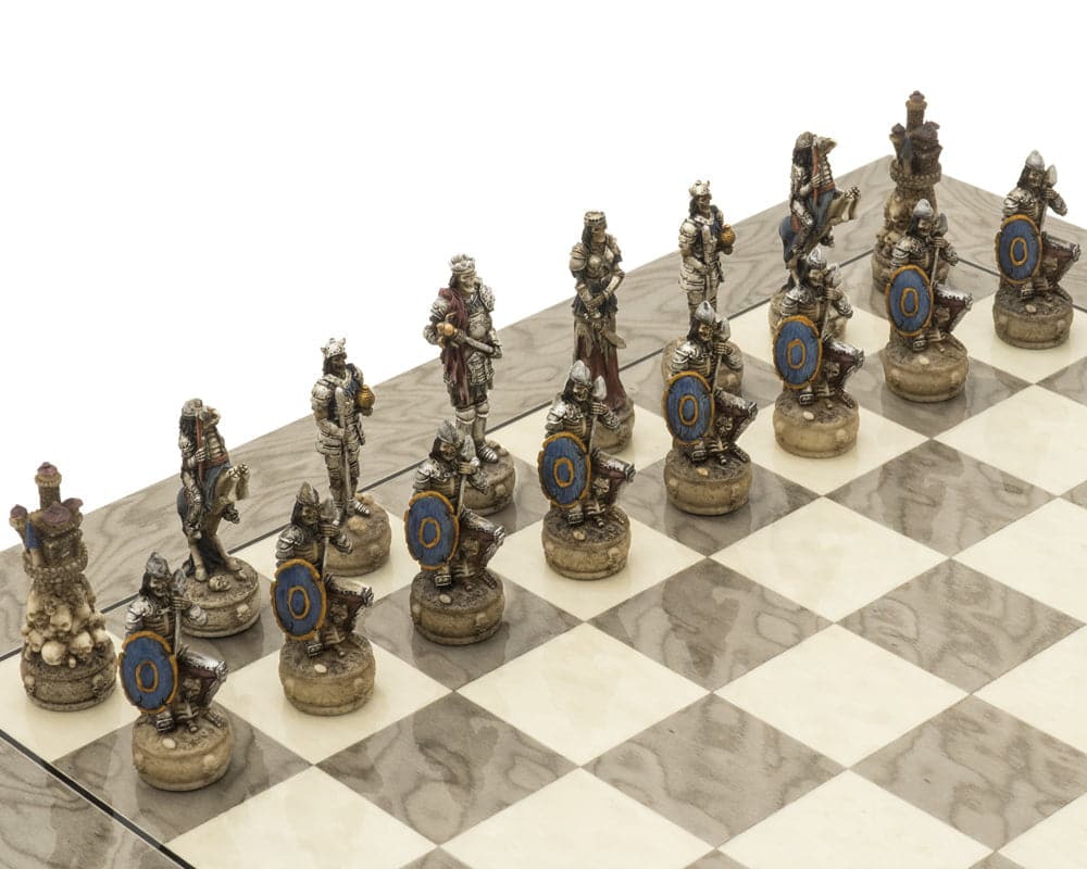 The Zombie and Grey Ash Deluxe Chess Set pieces on an intricately detailed glossy grey ash burl board.