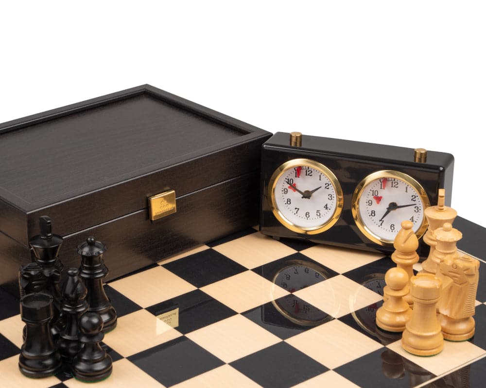 The French Knight Luxury Black Chess Set with board, clock, and elegant black and white chess pieces.