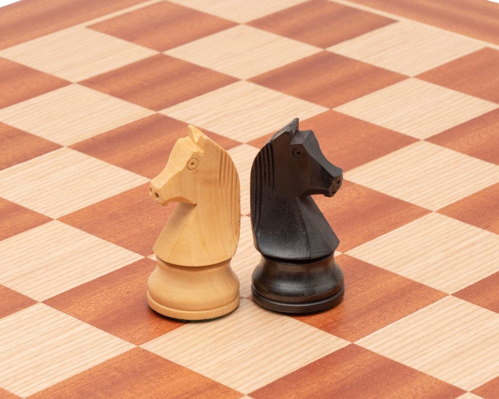 Down Head Knight Tournament Edition chess set knights on a high-quality Mahogany and Birch chessboard with 2-inch playing squares.