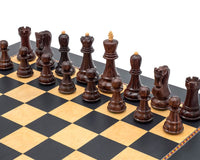 The Queens Gambit Chess Set with dark decorative border and quality wooden pieces on a Rechapados Ferrer board